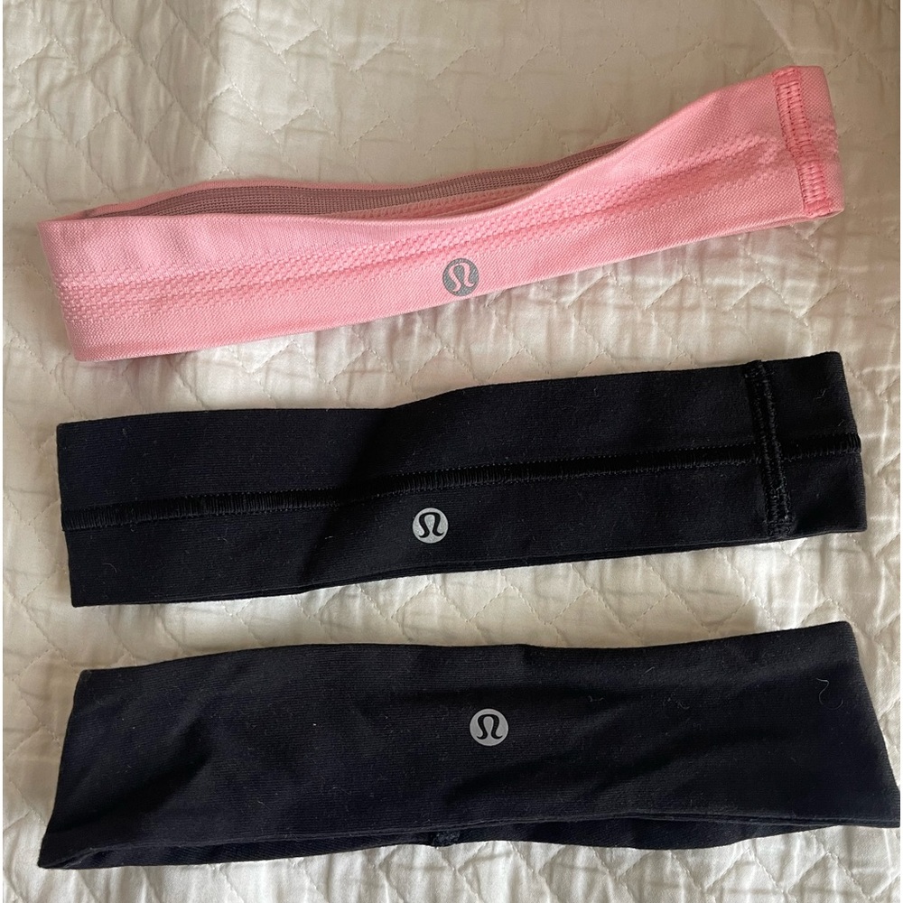 Lululemon headband. 2 black 1 pink.
